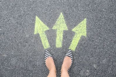 bigstock-Woman-Standing-On-Road-Near-Ar-257284375